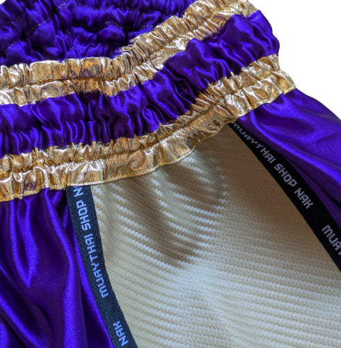 ムエタイショップNAKオリジナルのオーダーキックパンツ(ショート丈)パープルxゴールド、刺繍カスタム対応