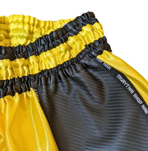 ムエタイショップNAKオリジナルのオーダーキックパンツ(ショート丈)イエローxブラック、刺繍カスタム対応